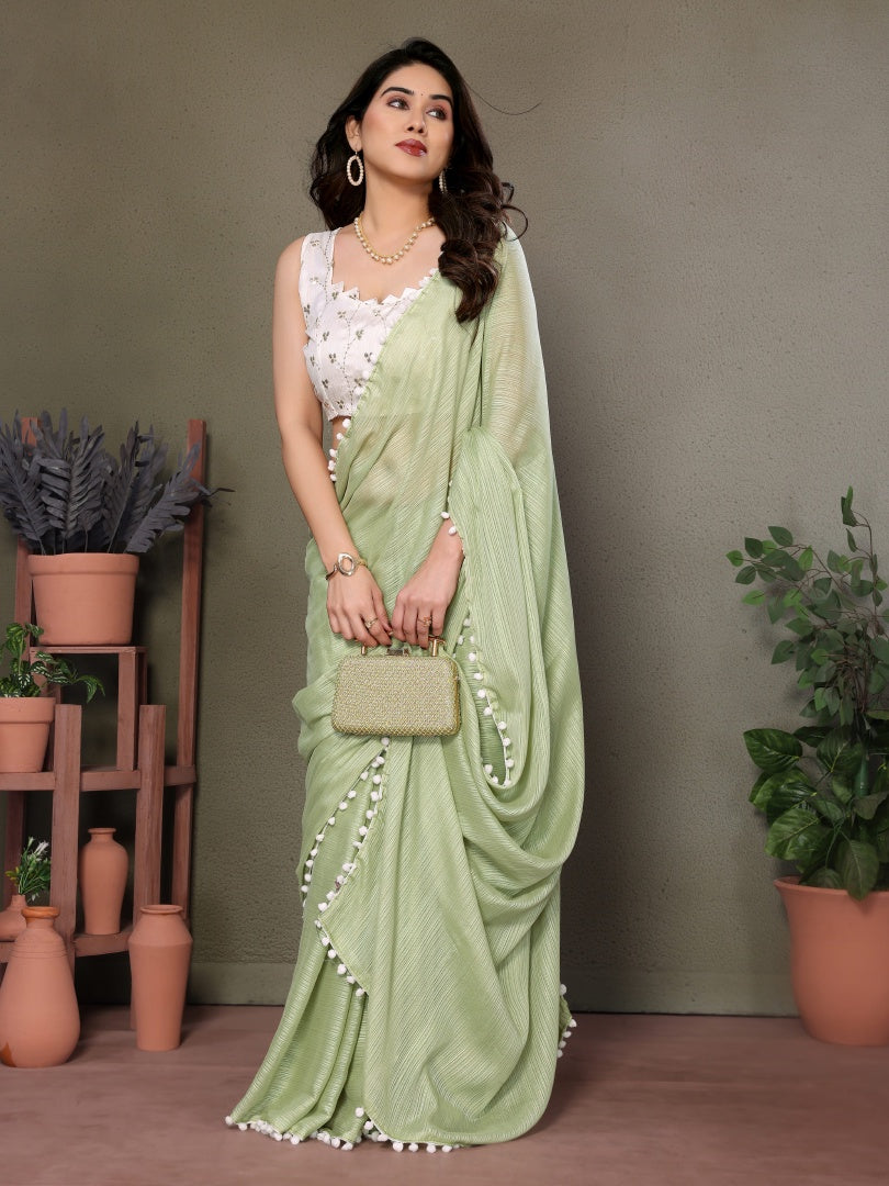 Refreshing Pista Green Polyester Zari Saree with Embroidered Blouse & Pum Pum Lace