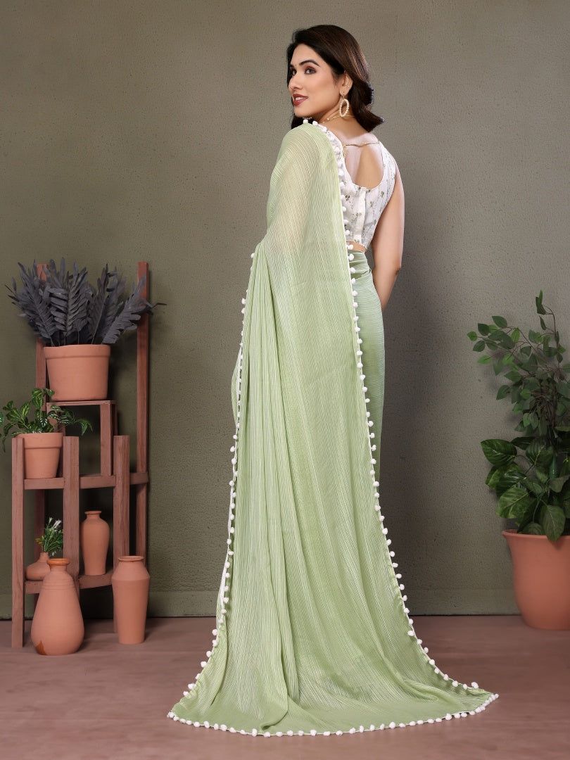 Refreshing Pista Green Polyester Zari Saree with Embroidered Blouse & Pum Pum Lace