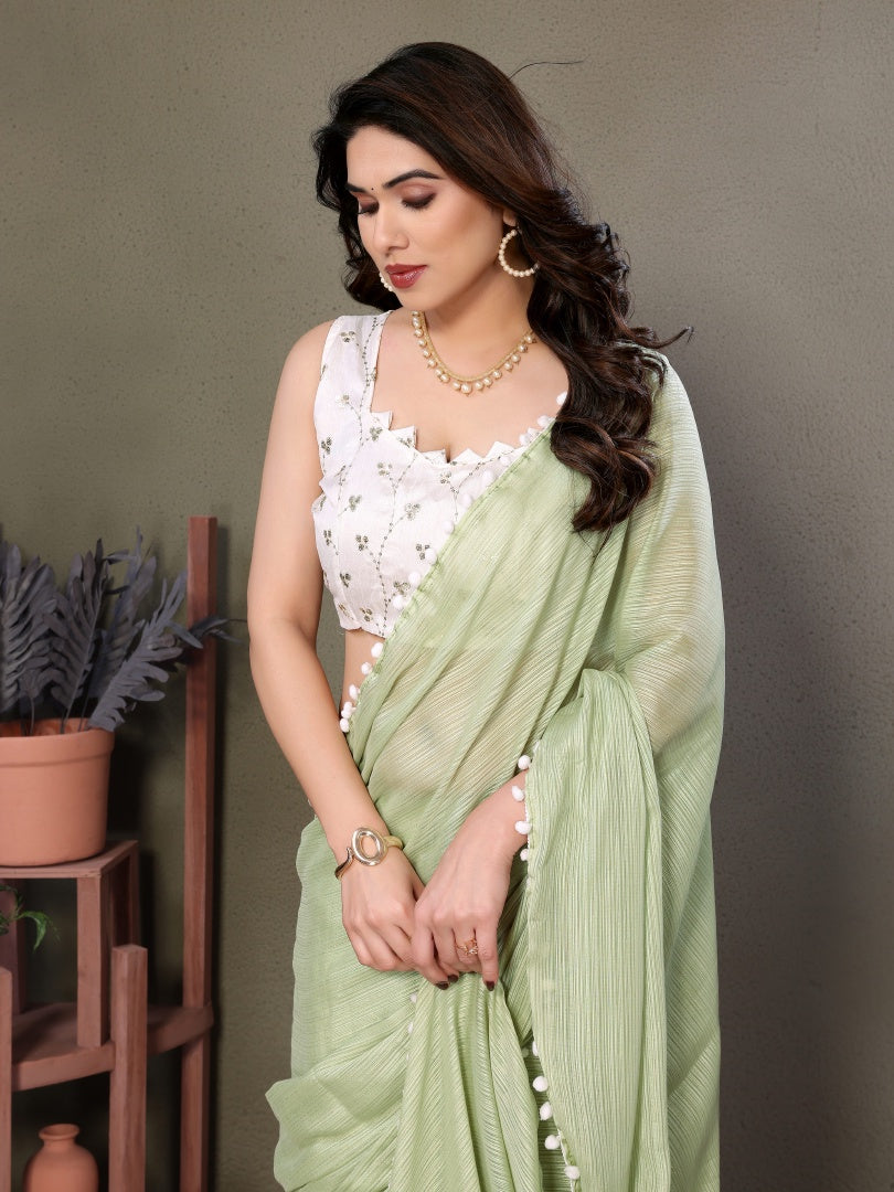 Refreshing Pista Green Polyester Zari Saree with Embroidered Blouse & Pum Pum Lace